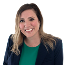 Portrait of a smiling Corinne Henyan in a nice suit